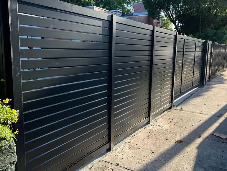 Residential property with black aluminium slat fence